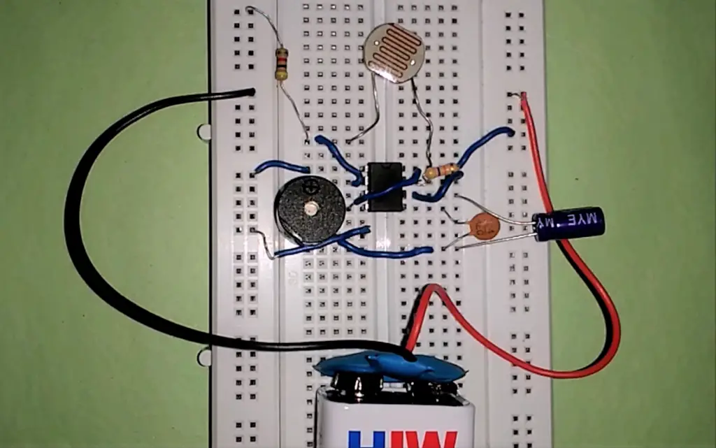 Circuit diagram for LDR as a dark sensor using 555 timer on breadboard