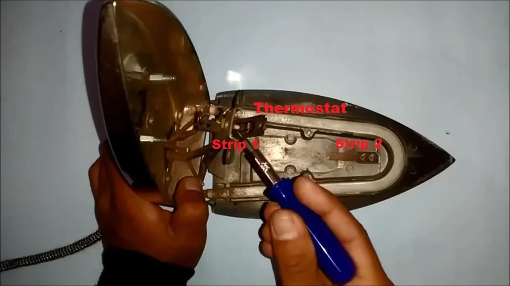 Thermostat and bimetallic strip