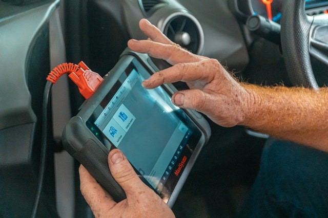 An OBD scanner connected through a OBD connector